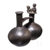 A Peruvian painted clay double-vessel, Chimu culture, probably 11th - 15th century
