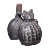 A Peruvian figural clay double-vessel, probably Chimu culture, 11th - 15th century