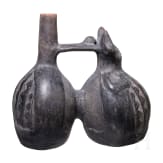A Peruvian figural clay double-vessel, probably Chimu culture, 11th - 15th century