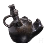 A Peruvian animal-head shaped blackware vessel, probably Chimu culture, 11th - 15th century