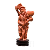 A figural coral carving showing a Chinese fisherman