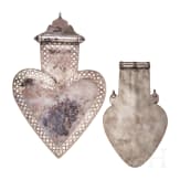 Two heart-shaped and partially gilt Turkmen silver and carnelian Teke "asyk" back-pendants, circa 1900