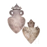 Two heart-shaped and partially gilt Turkmen silver and carnelian Teke "asyk" back-pendants, circa 1900
