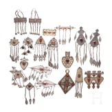 19 partially gilt Turkmen silver and carnelian pendants, circa 1900