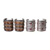 Two pairs of partially fire-gilt Turkmen silver and carnelian cuff bracelets, circa 1900
