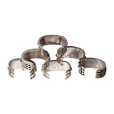 Six fire-gilt Turkmen silver and carnelian Teke bracelets, circa 1900