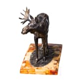 A bronze elk figure on an amber-mounted wooden stand, Hendrik Scholter, circa 1930