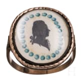 A 8ct gold ring with two portraits