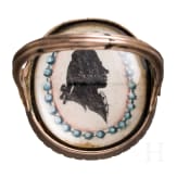 A 8ct gold ring with two portraits