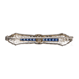 A 14ct gold brooch set with sapphires and diamond