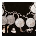 A group of German and Polish silver trinkets including a shooting champion's necklace, 19th century