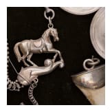A group of German and Polish silver trinkets including a shooting champion's necklace, 19th century