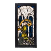 A German leaded stained glass window showing a praying donor, mid 15th century