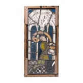 A German leaded stained glass window showing a praying donor, mid 15th century