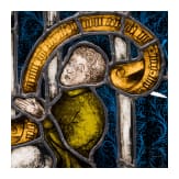 A German leaded stained glass window showing a praying donor, mid 15th century