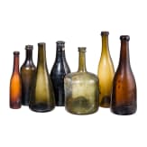 Seven German glass bottles, 18th (wine bottle)/19th century