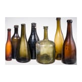 Seven German glass bottles, 18th (wine bottle)/19th century