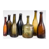 Seven German glass bottles, 18th (wine bottle)/19th century