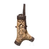 A fine South German carved staghorn powderflask with etched mountings, dated 1597