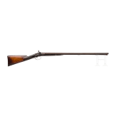 A side-by-side shotgun by J. Manton in London, with case