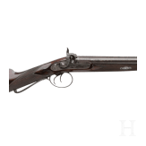 A side-by-side percussion shotgun by Purdey, with case