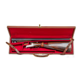 A cased side-by-side shotgun by Churchill, London