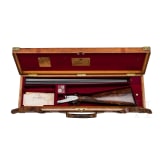 A side-by-side shotgun by Purdey & Sons, London, in case