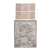 A large biscuit porcelain plaque and six small plaques with erotic scenes