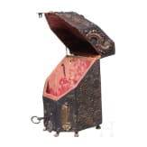 A copper and coin-mounted leather cutlery casket