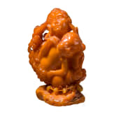 A figural amber carving showing a mother with her child