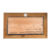 A framed amber carving showing two faces, Erbach/Hanau, 20th century