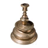 A large engraved Nuremberg brass bell-bottom candlestick, ca. 1670/80