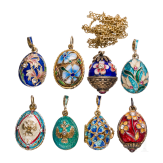 Eight Russian silver-gilt and enamelled egg-pendants, 20th century