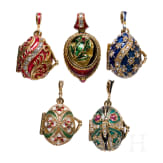 Five Russian silver-gilt and enamelled egg-pendants, 20th century
