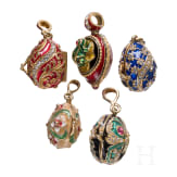 Five Russian silver-gilt and enamelled egg-pendants, 20th century