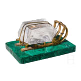 A Russian gilt-bronze sledge-shaped paperweight on a malachite stand, 20th century