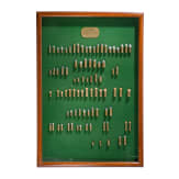 A cartridge display by Remington / UMC, with 87 sample cartridges, ca. 1905