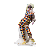A porcelain figure of Mezzetin as a harlequin holding a baby monkey from the Commedia dell'arte series, Franz Anton Bustelli, circa 1760 (design), Nymphenburg, 20th century
