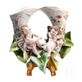 A porcelain double vase with putti on flowers, 20th century
