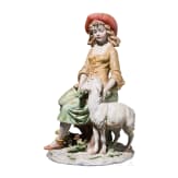 Two Italian biscuit porcelain figures (couple) of a boy with bagpipe and a girl feeding a goat, Benaccio (design), Capodimonte, Triade, 20th century