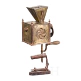 An early coffee grinder and a flatiron, probably French, dated 1864