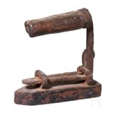 An early coffee grinder and a flatiron, probably French, dated 1864