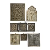 Five brass icons and a plated four-field-icon on wood panel, Russia, most 20th century