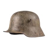 A steel helmet M 16 with remnants of camouflage paint