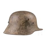A steel helmet M 16 with remnants of camouflage paint