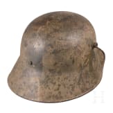 A steel helmet M 16 with remnants of camouflage paint