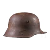 A steel helmet M 16 with remnants of camouflage paint