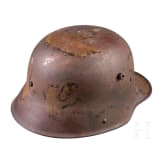 A steel helmet M 16 with remnants of camouflage paint