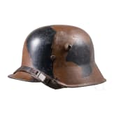 A steel helmet M 18 with camouflage painting