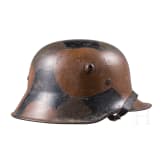 A steel helmet M 18 with camouflage painting